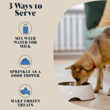 A happy dog and cat enjoying meals topped with goat’s milk powder, illustrating its delicious flavour and digestive health benefits.